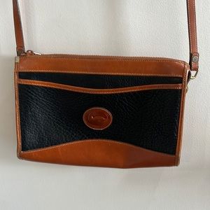 Vintage Dooney and Bourke crossbody leather bag. Black and tan.